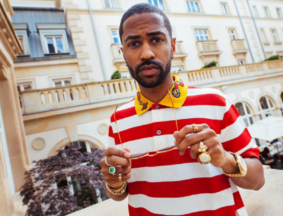 Big Sean Spotted In Germany Wearing Gucci Slippers and Polo Shirt