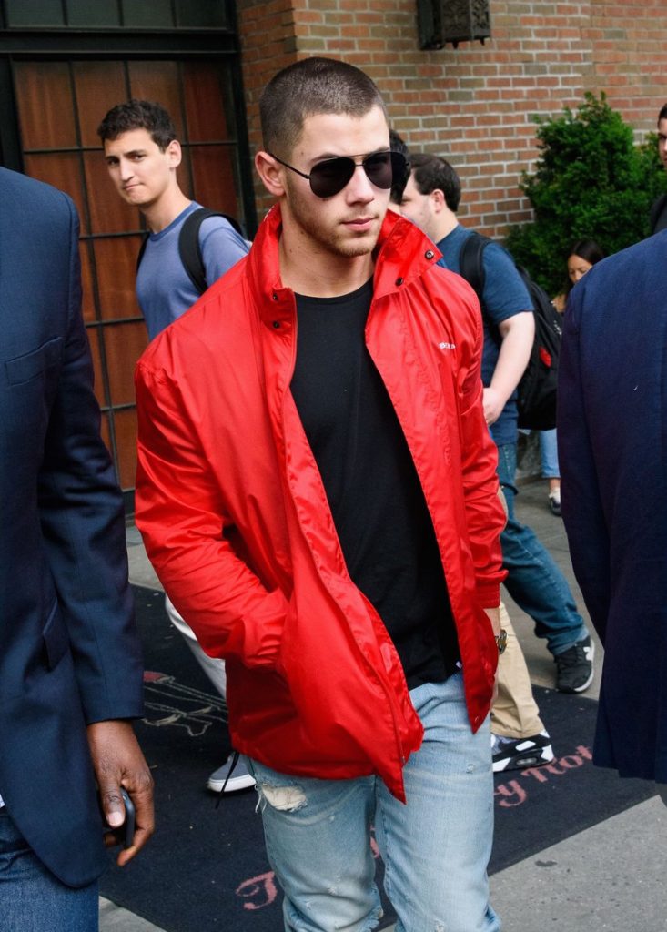 Nick Jonas In Red Balenciaga Jacket 