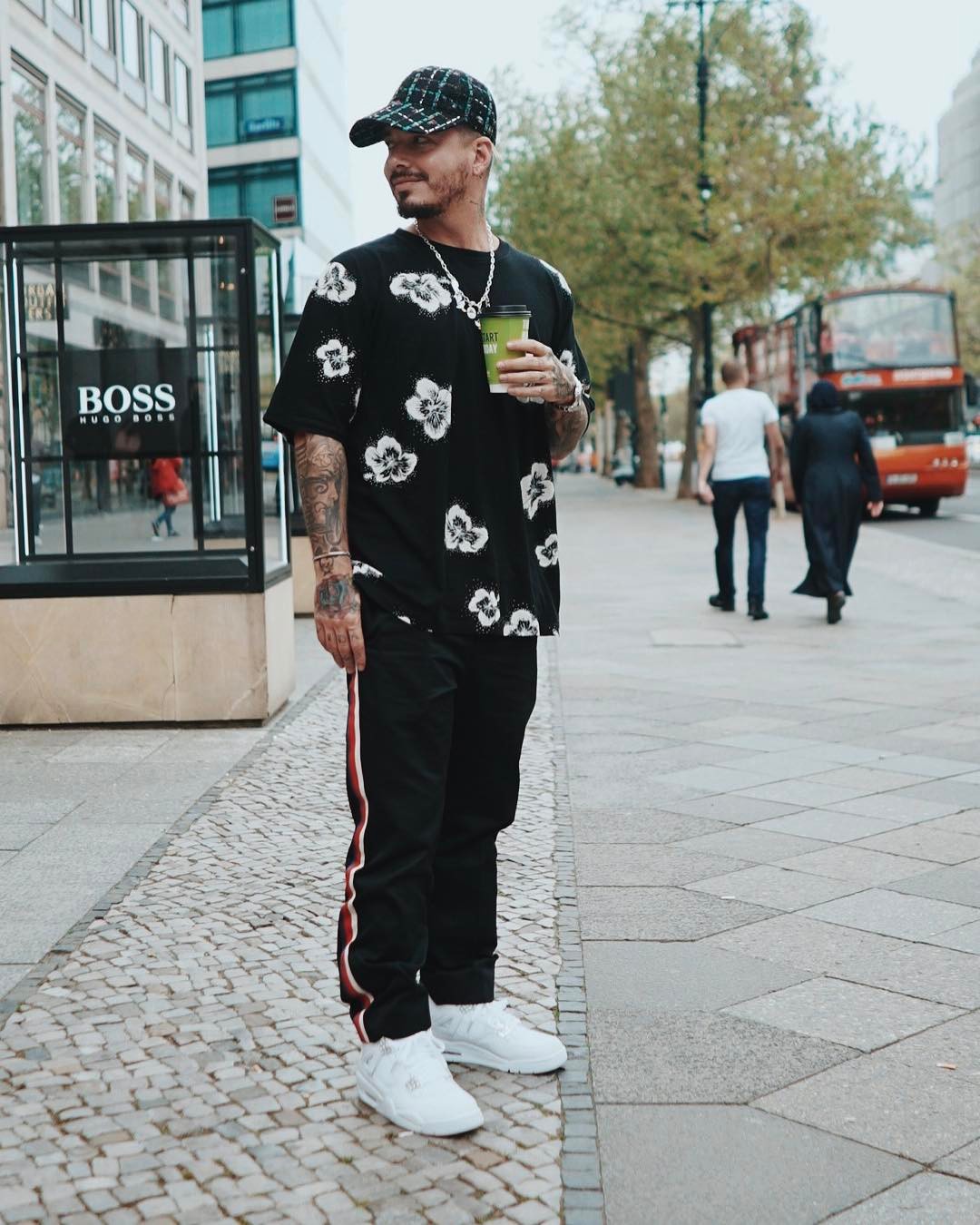 SPOTTED: J Balvin in Saint Laurent T-Shirt, Gucci Pants and Air Jordan Retro 4 Sneakers