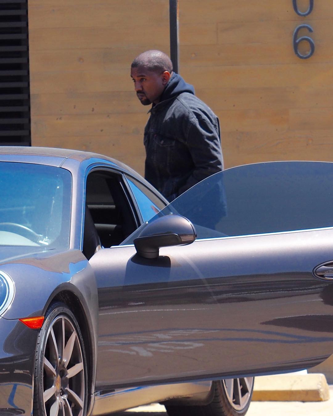 SPOTTED: Kanye West in Vetements x Levi’s Jacket and Raf Simons x Adidas Originals Sneakers