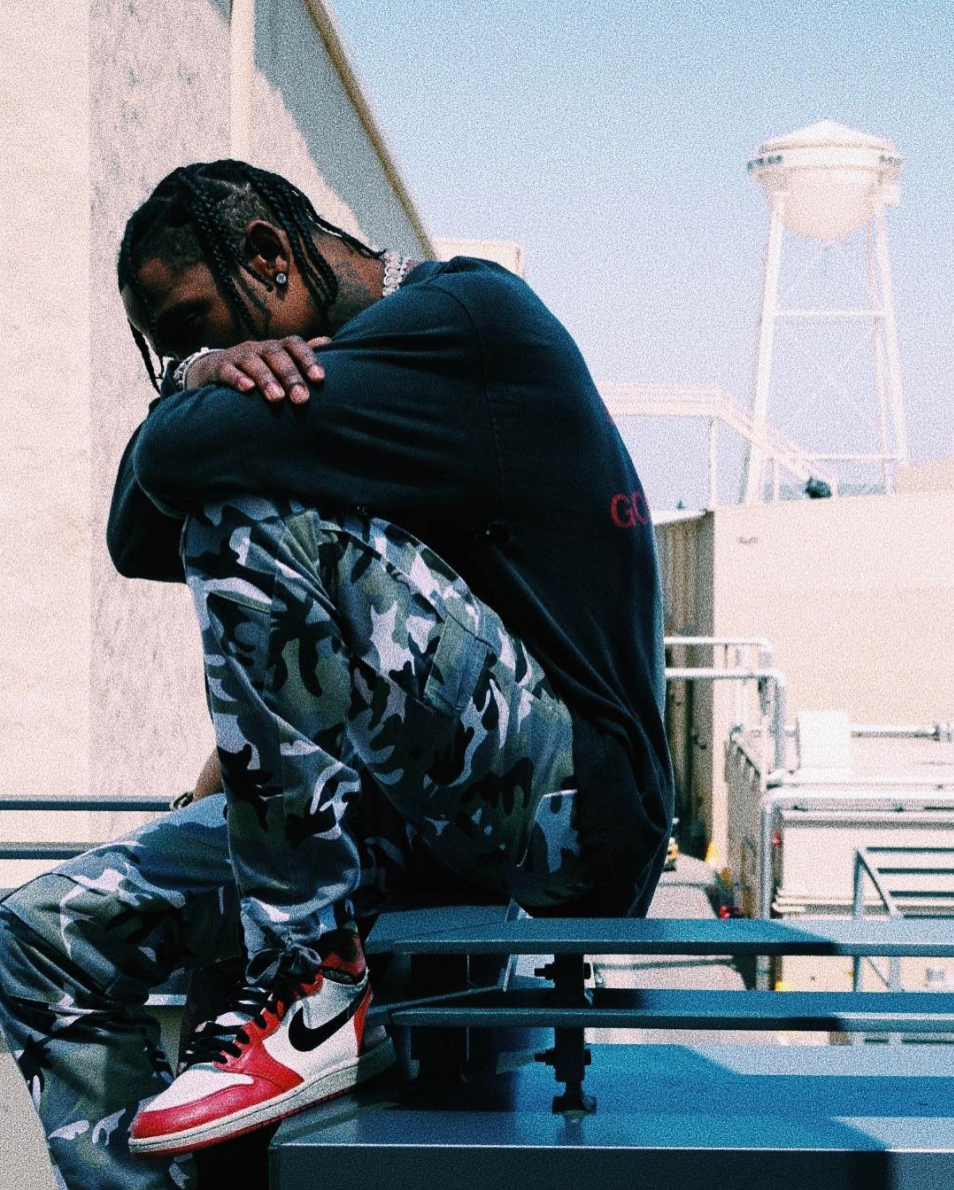SPOTTED: Travis Scott In Snow Camo Cargo Pants And Nike Air Jordan Retro 1 Sneakers