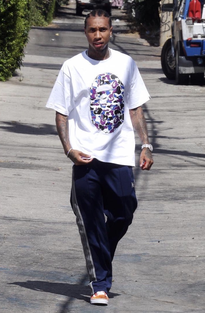 SPOTTED: Tyga In BAPE T-Shirt, Needles Track Pants And Custom Vans