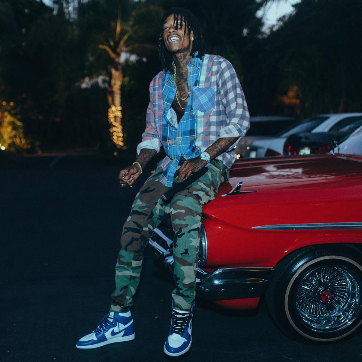 SPOTTED: Wiz Khalifa In Camo Pants And Air Jordan 1 Retro Sneakers