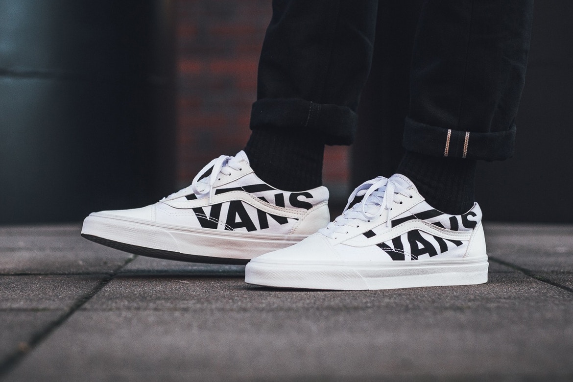 white vans with black words online -