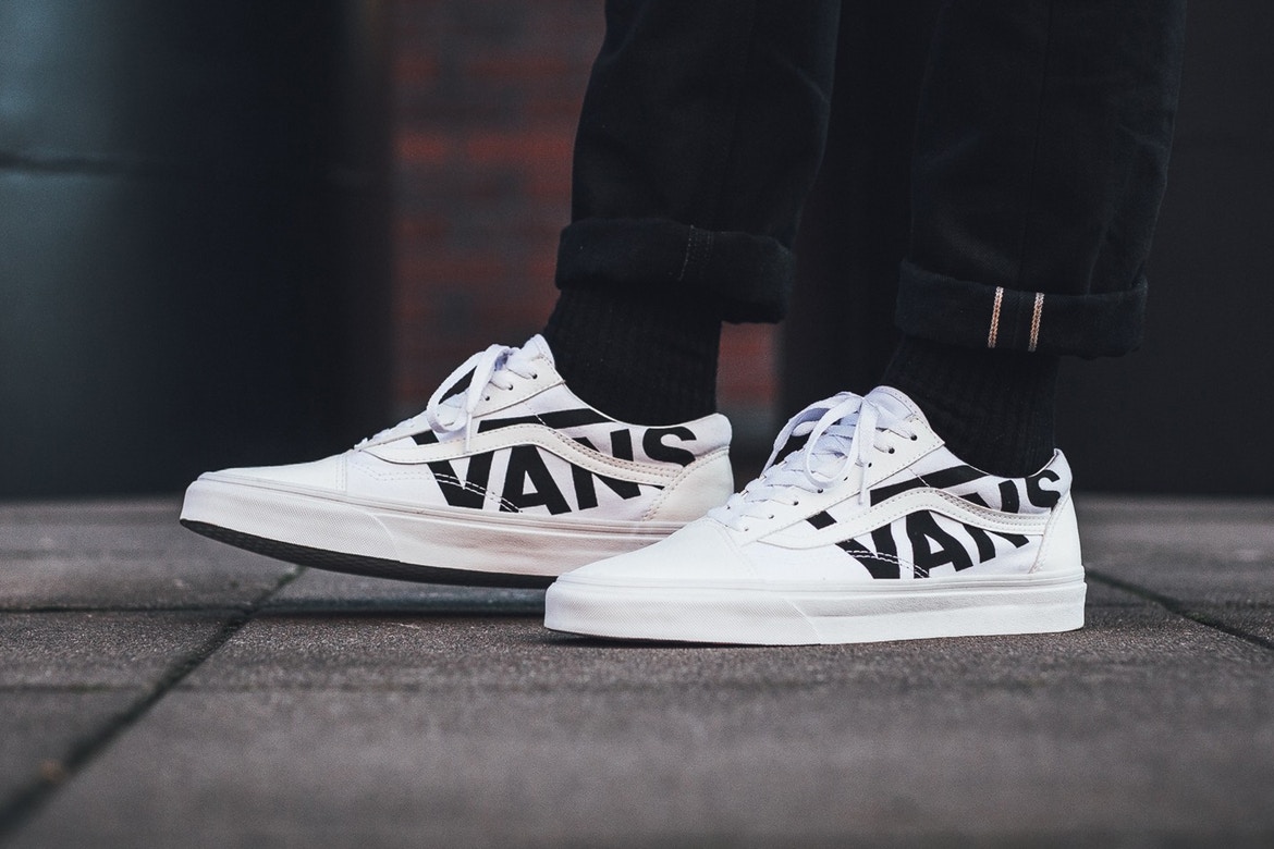 white vans with black words