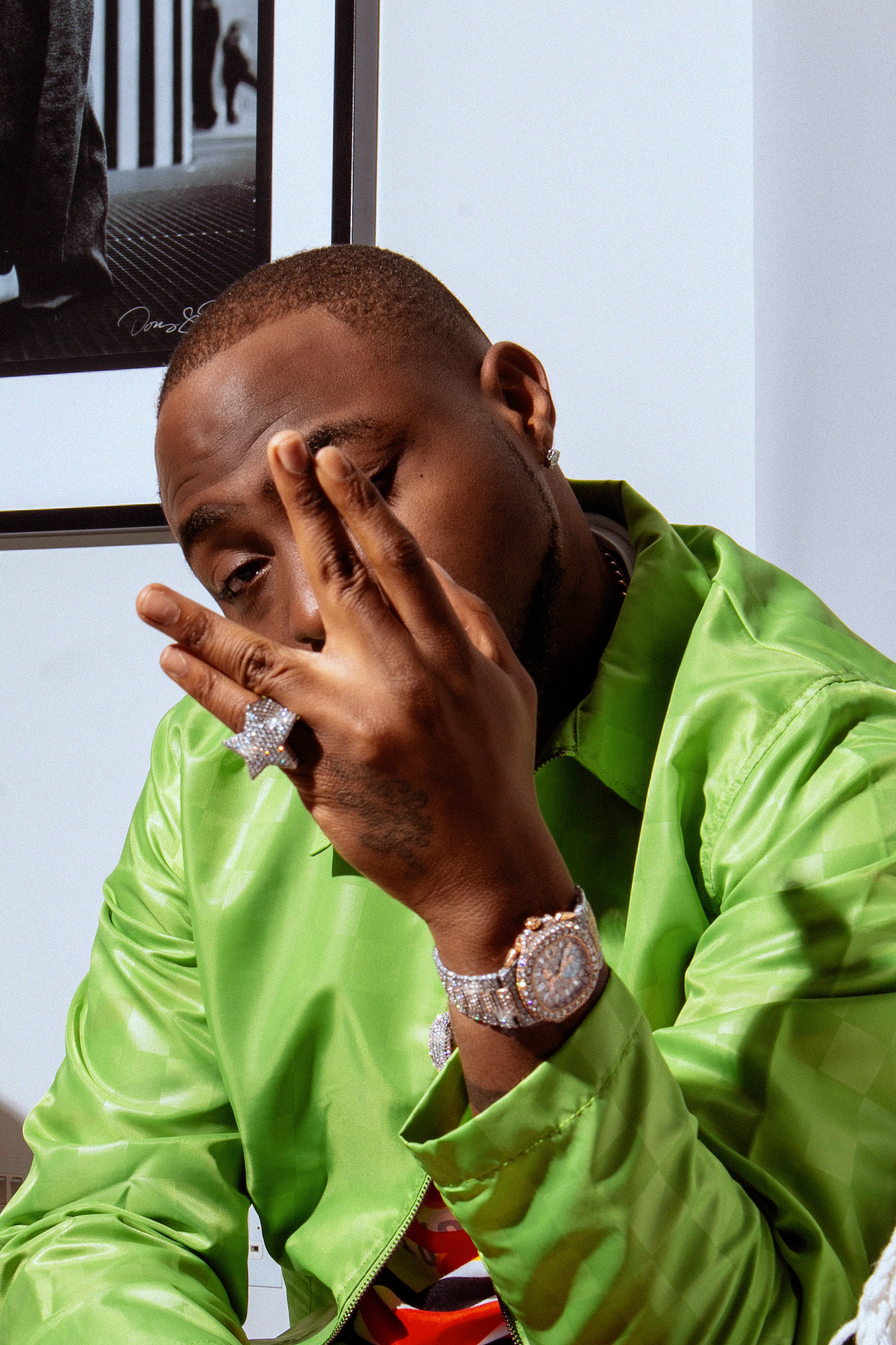 Davido Wearing a Burberry Puffer Jacket With a Blue Louis Vuitton Tracksuit