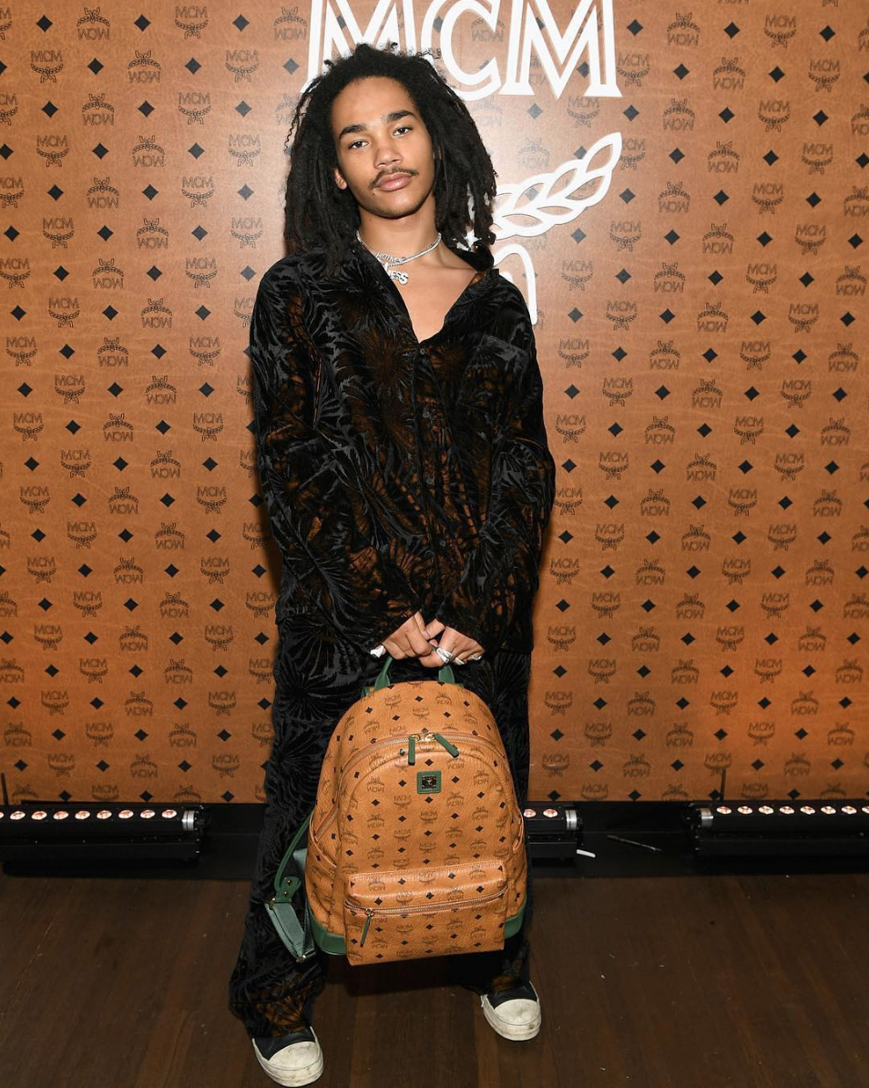 Luka Sabbat wears cap, coat outside Rick Owens during the