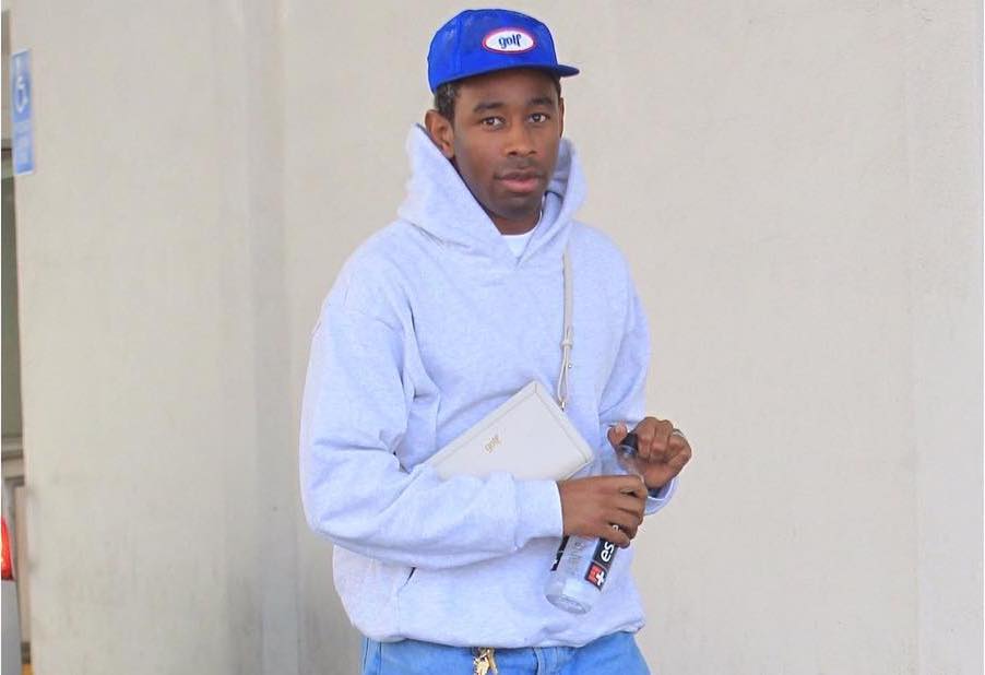 SPOTTED: Tyler The Creator in Grey Hoodie, Blue Jeans & GOLF Cross Bag