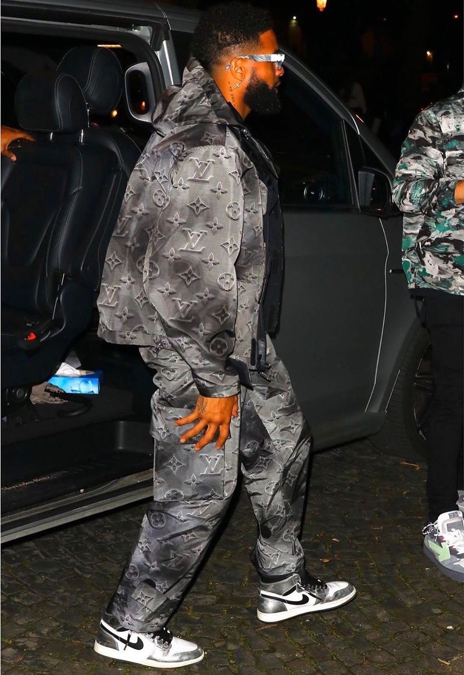 Odell Beckham Jr wears a Louis Vuitton Jacket and 99%IS- Pants for