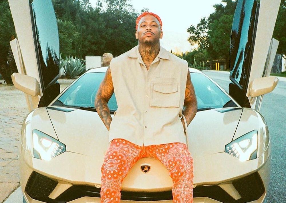 SPOTTED: YG Lounges on Lamborghini in Christian Louboutin & Piet