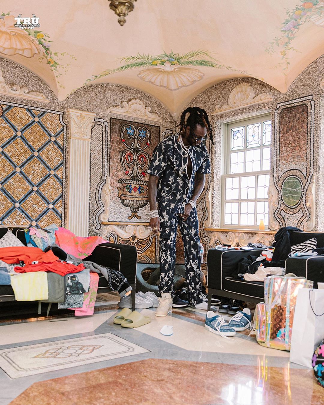 SPOTTED: 2 Chainz Relaxes in Louis Vuitton and Yeezy Slides