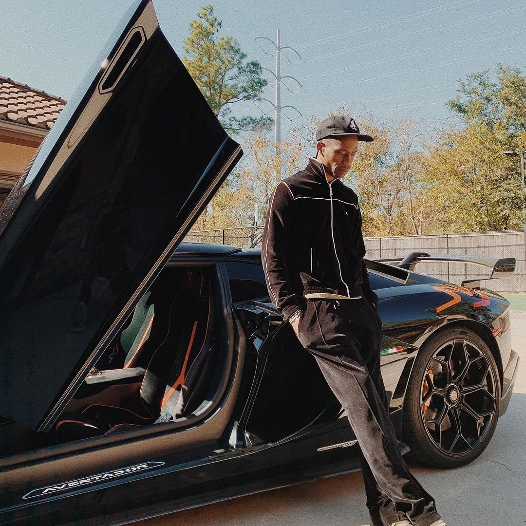 SPOTTED: Travis Scott Lounges on Lamborghini in Celine Tracksuit ...