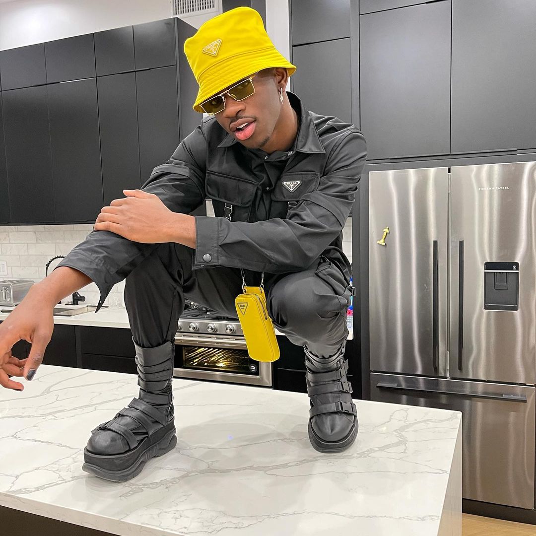 SPOTTED: Lil Nas X in Black & Yellow Prada Getup – PAUSE Online | Men's  Fashion, Street Style, Fashion News & Streetwear