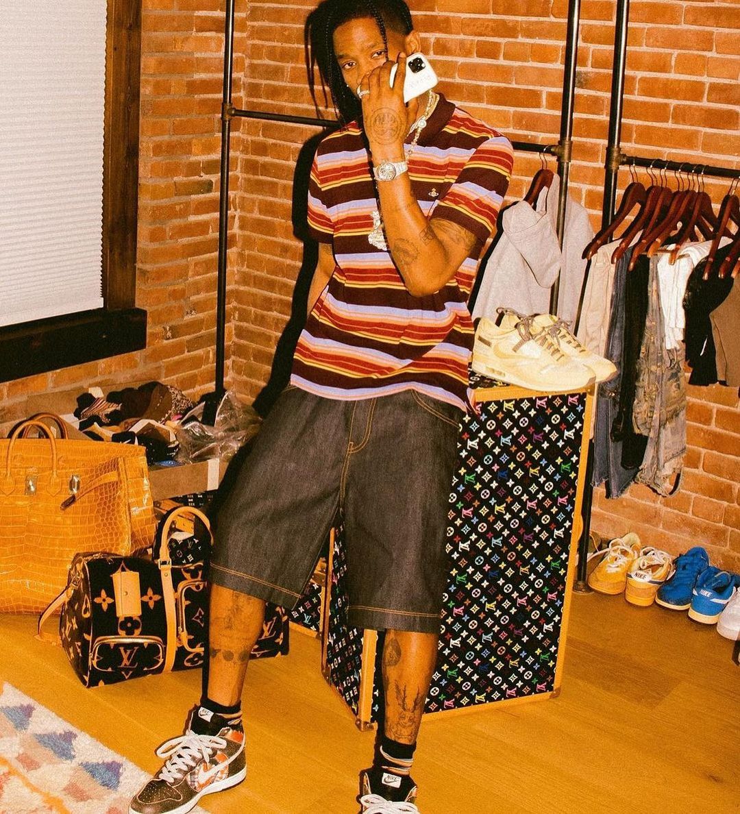 TravisScott is surrounded by @louisvuitton luggage & #lv bag, and