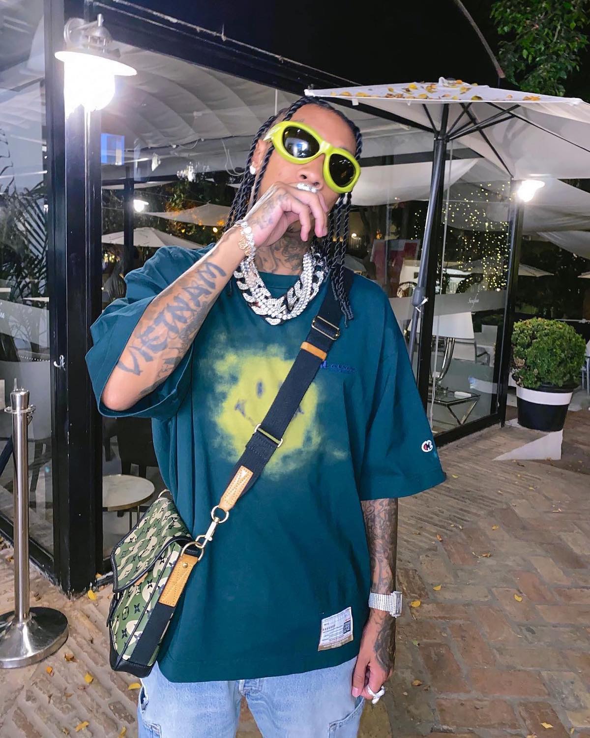 Tyga Rocks A Camouflage Louis Vuitton Jacket While Gassing Up His