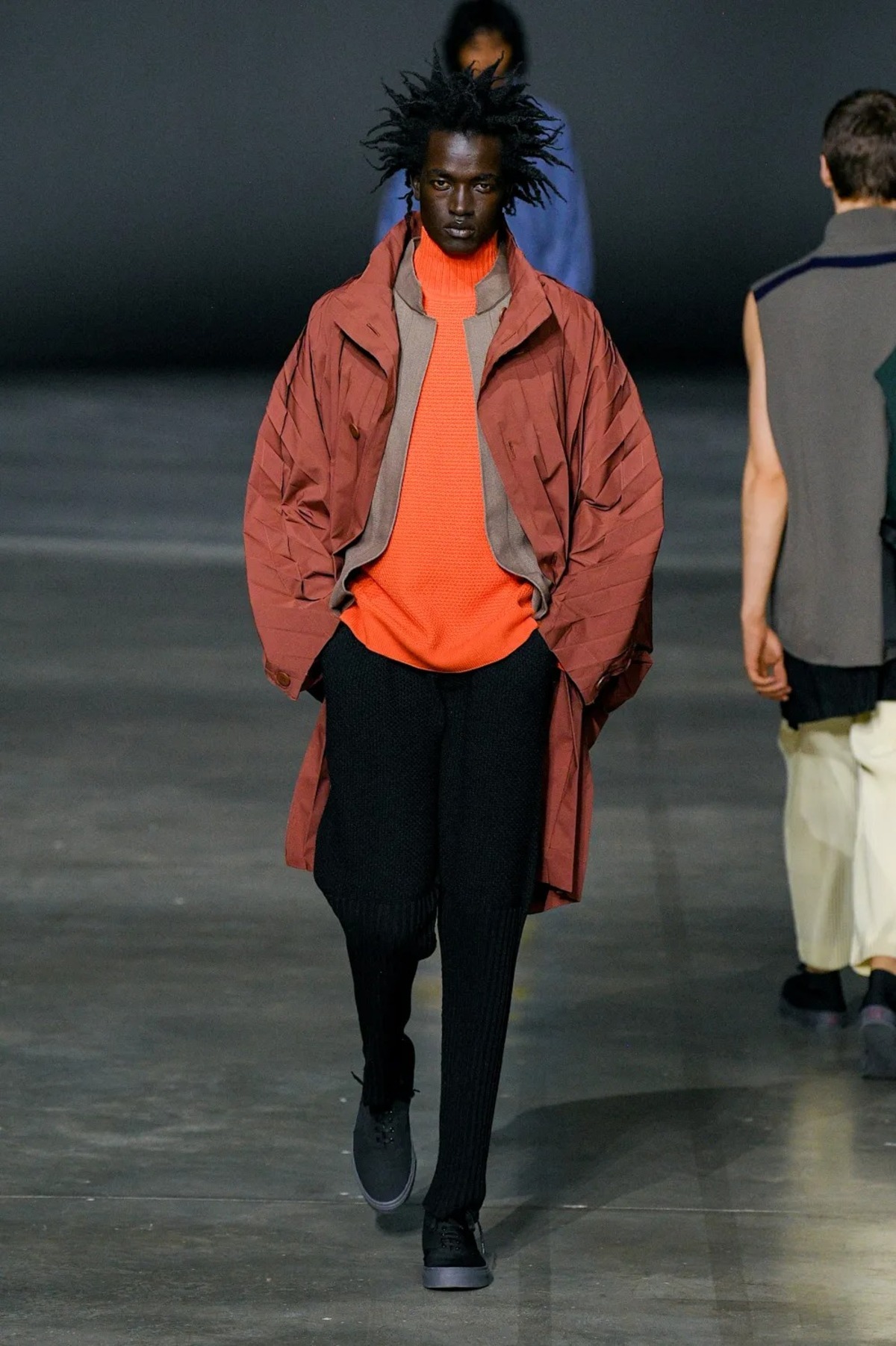 A guest is seen, after the Issey Miyake Men show, during Paris