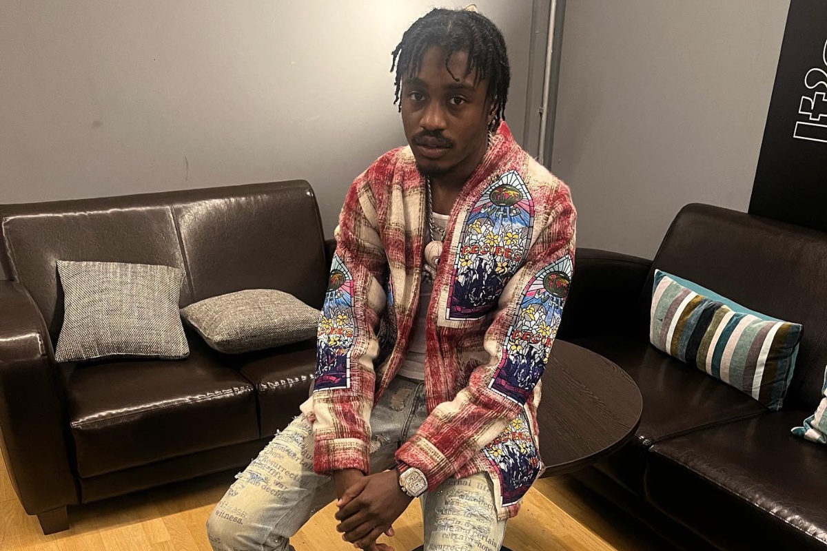 SPOTTED: Lil Tjay Touches Down in Germany for World Tour Wearing Full Who Decides War Ensemble