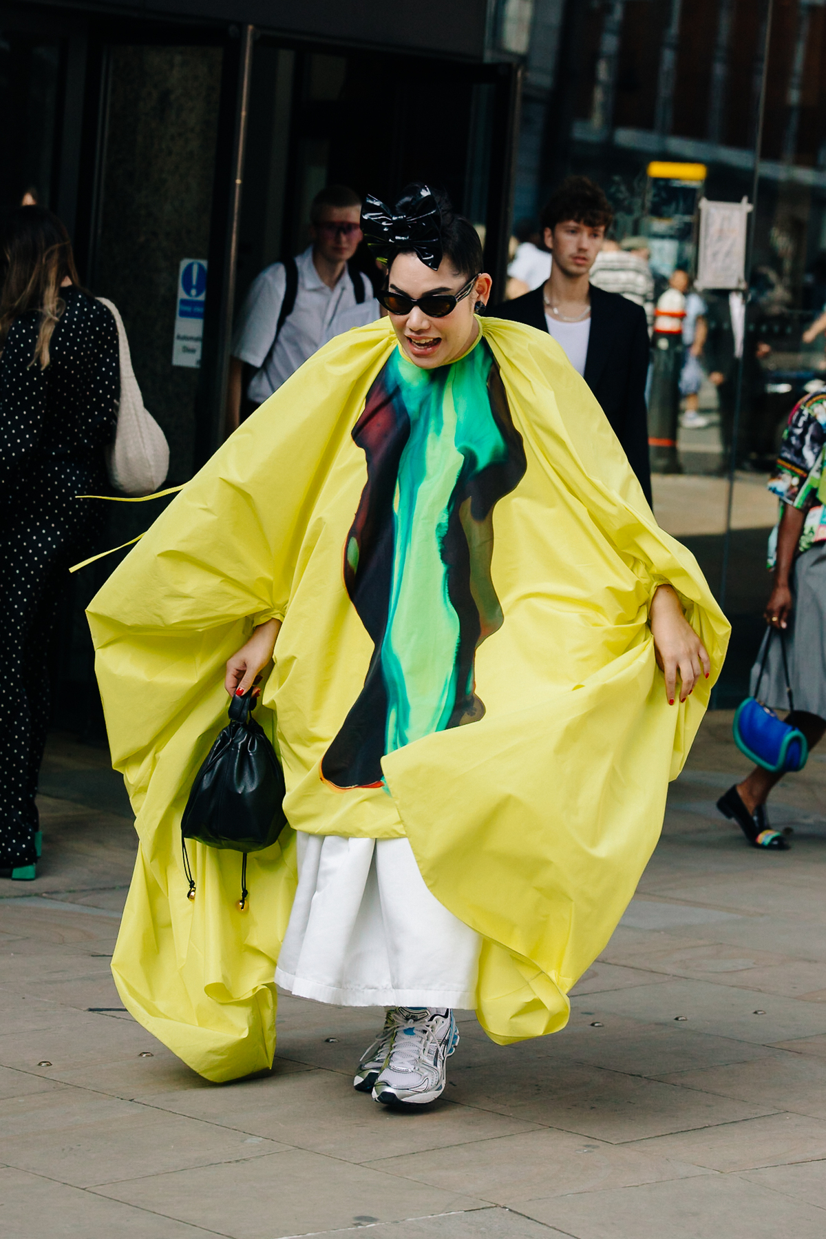 LONDON - 15 SEPTEMBER, 2017: Mid section detail of woman wearing Prada  clothes and handbag standing outside Somerset House, Day 1, London Fashion  Week. stock photo - OFFSET